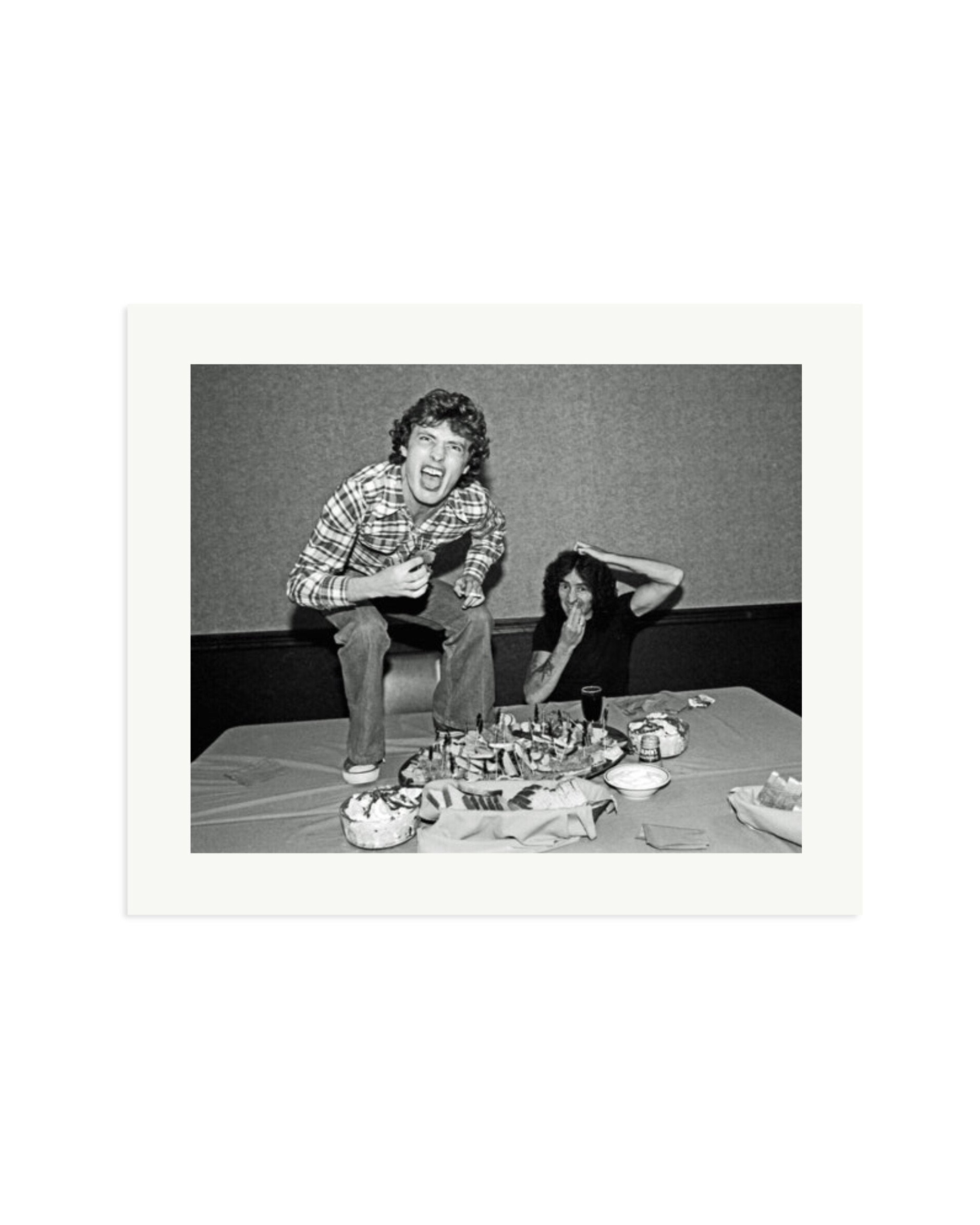 Angus Young and Bon Scott at Lunch, 1977 Print Only / Large