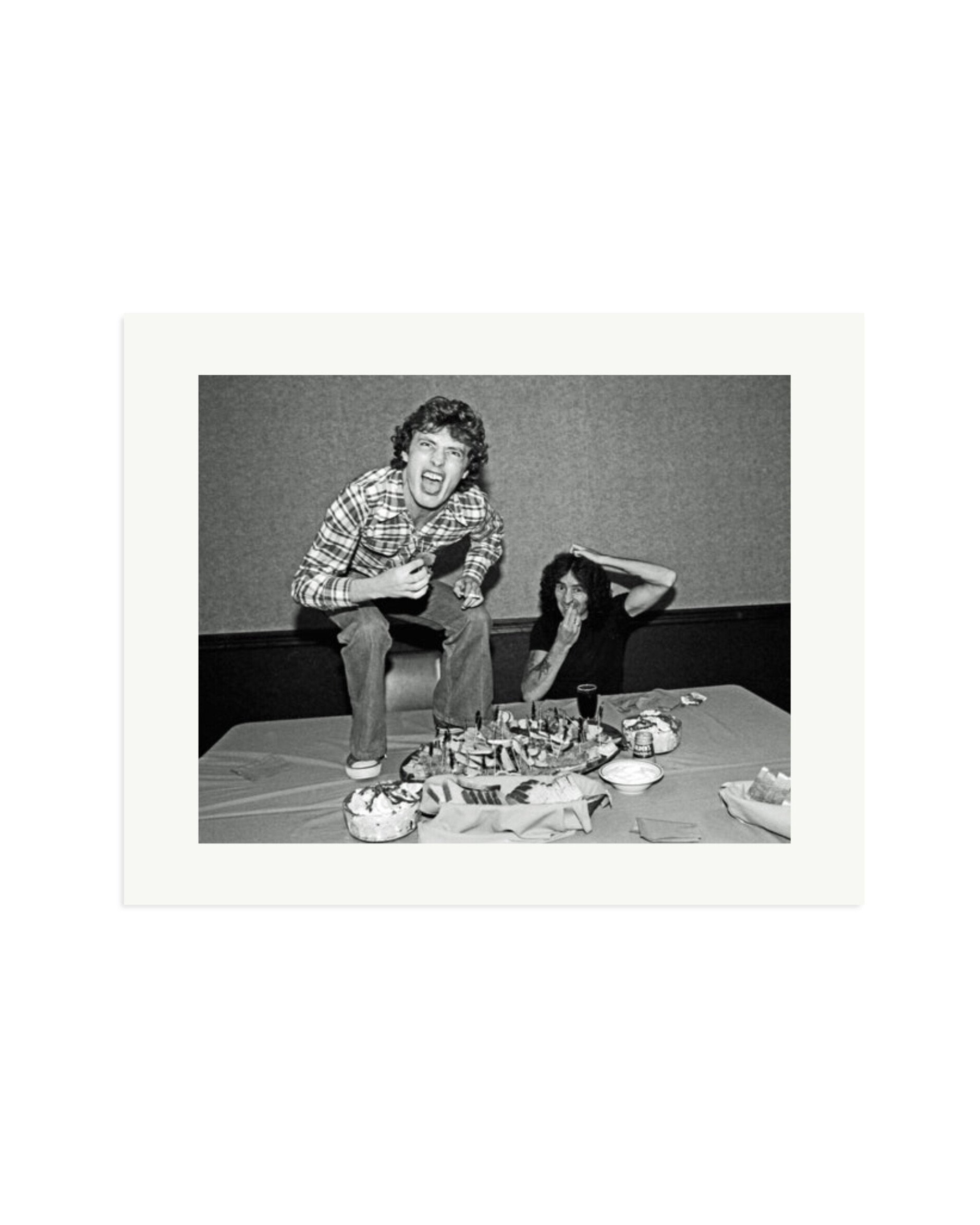 Angus Young and Bon Scott at Lunch, 1977 Print Only / XL