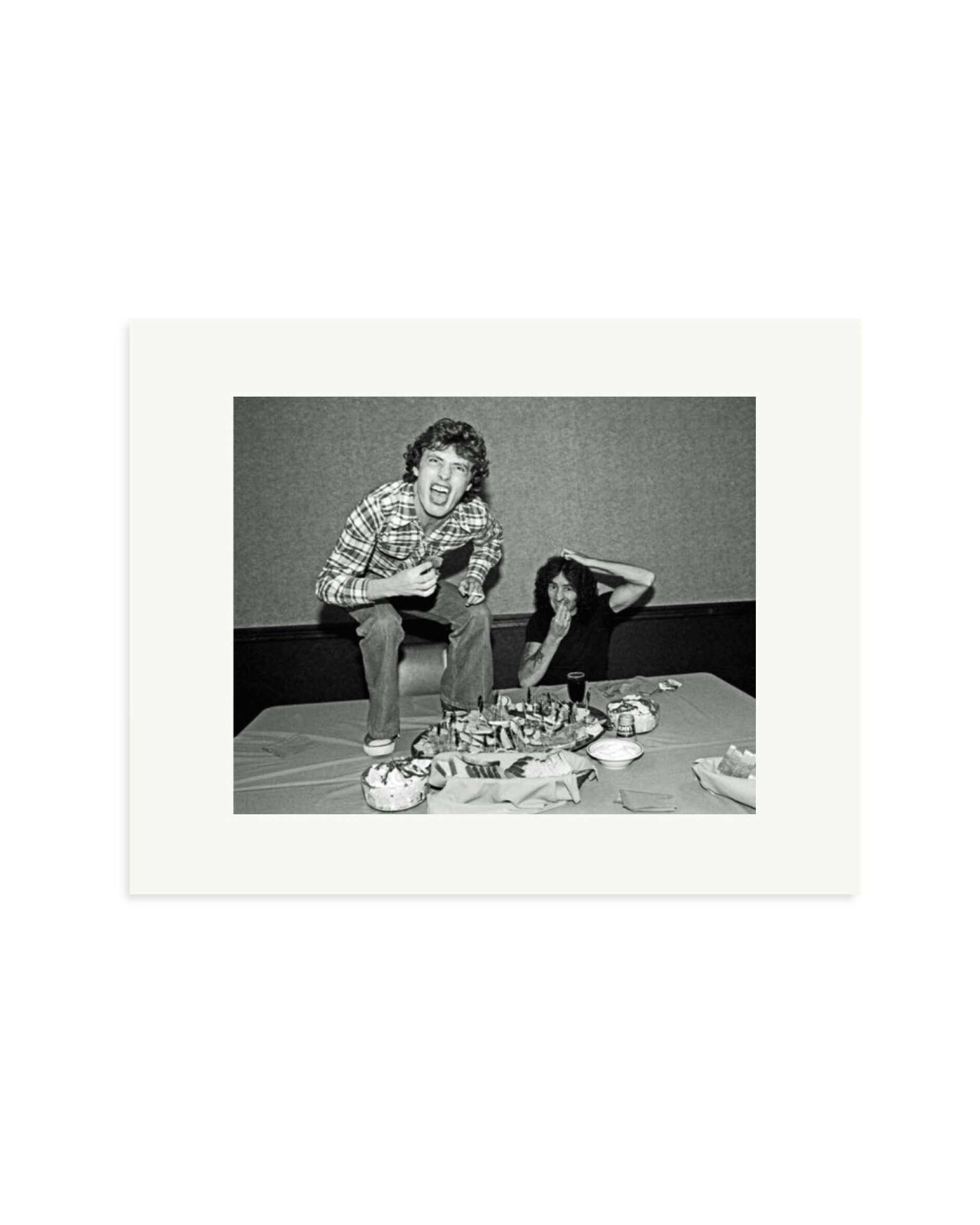Angus Young and Bon Scott at Lunch, 1977 Print Only / Small