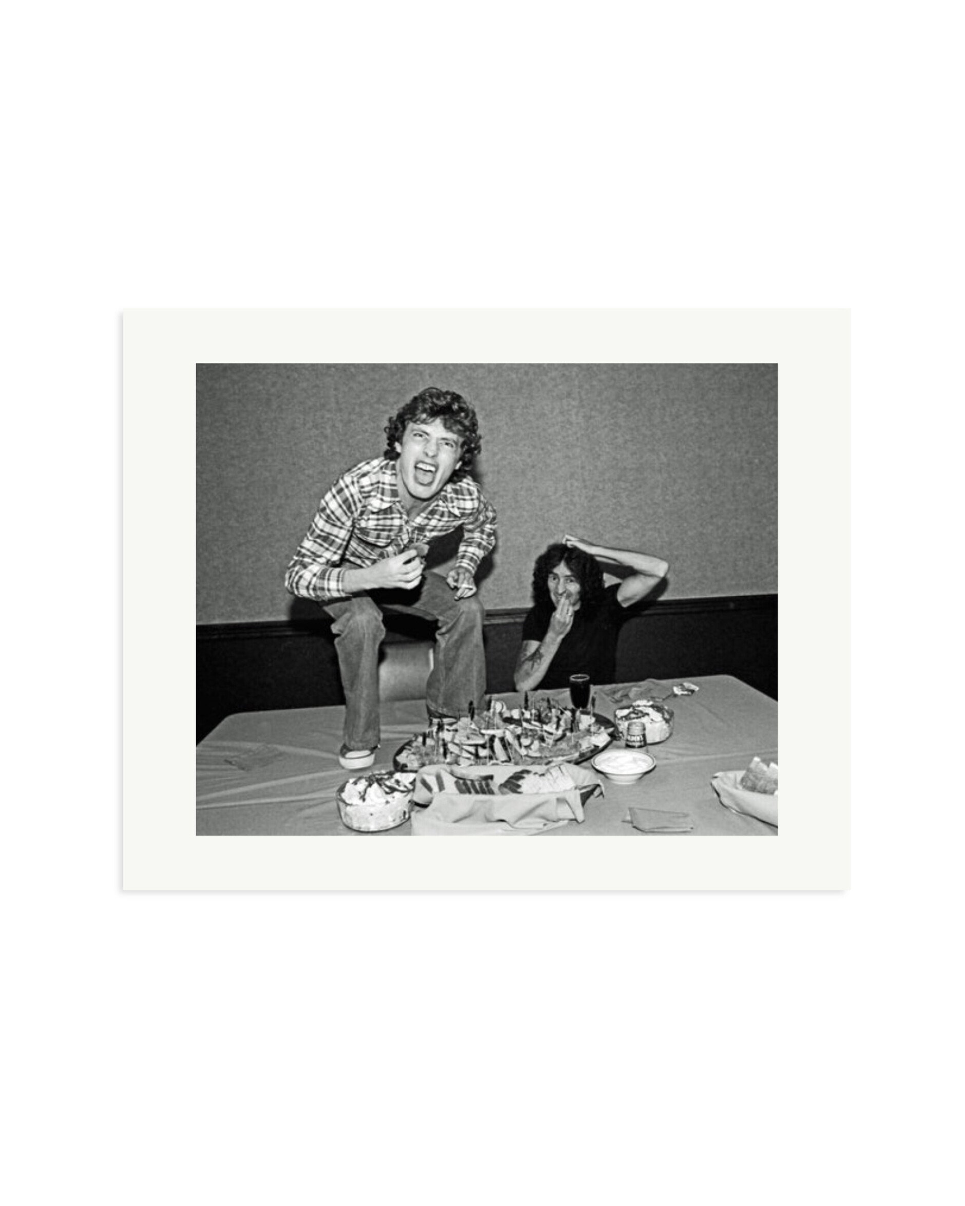 Angus Young and Bon Scott at Lunch, 1977 Print Only / Medium