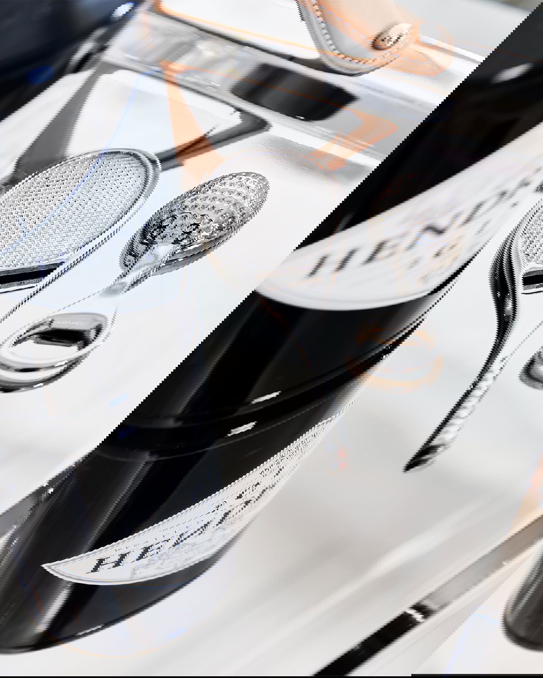 Tennisrack flasköppnare silver