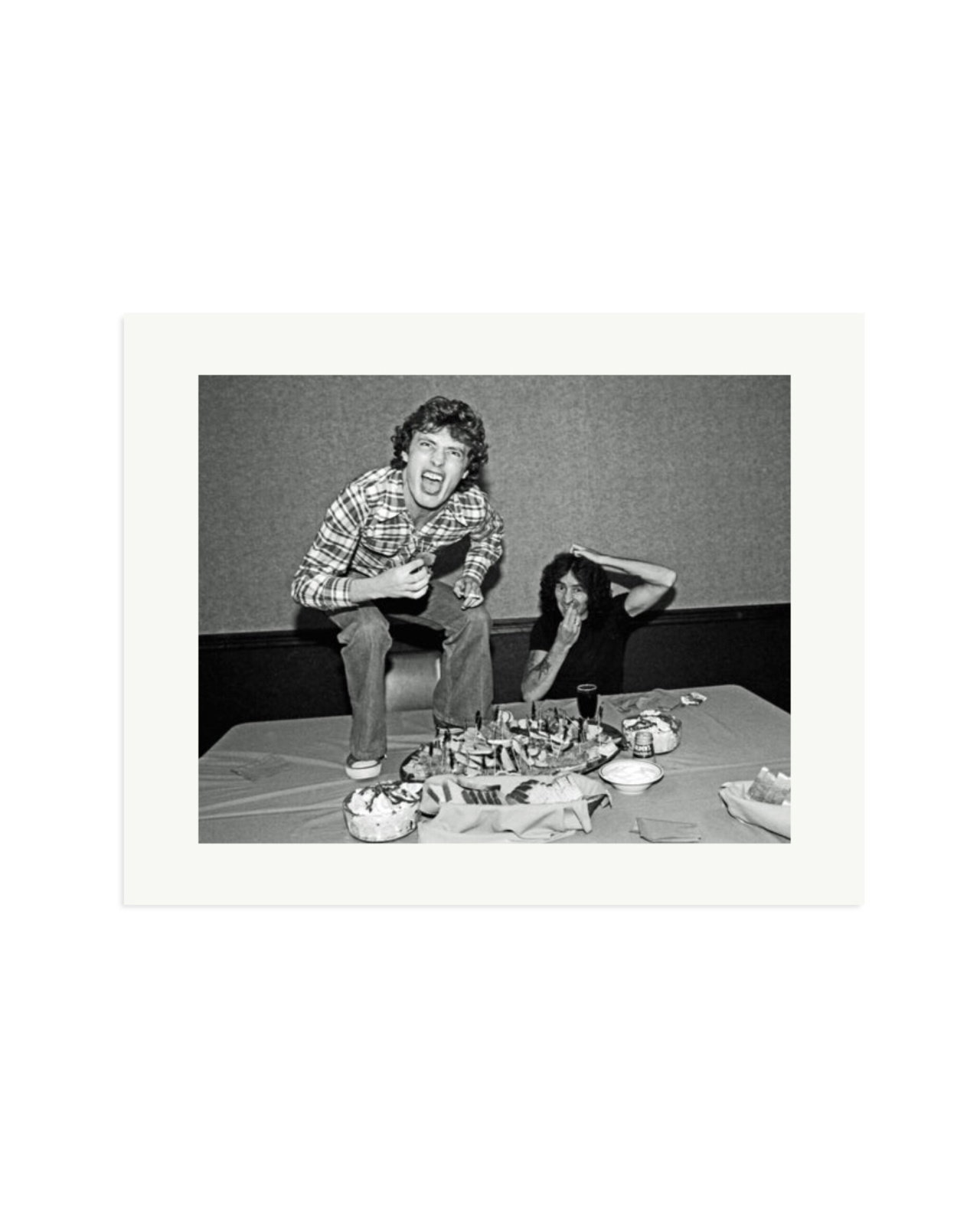 Angus Young and Bon Scott at Lunch, 1977 Print Only / XL