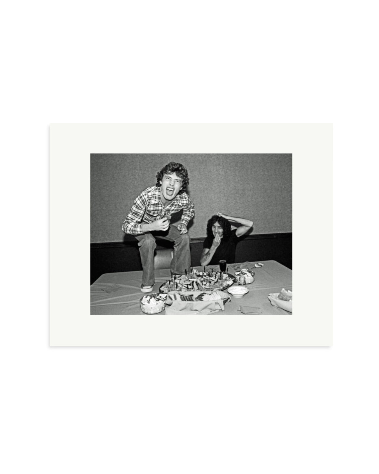 Angus Young and Bon Scott at Lunch, 1977 Print Only / Small