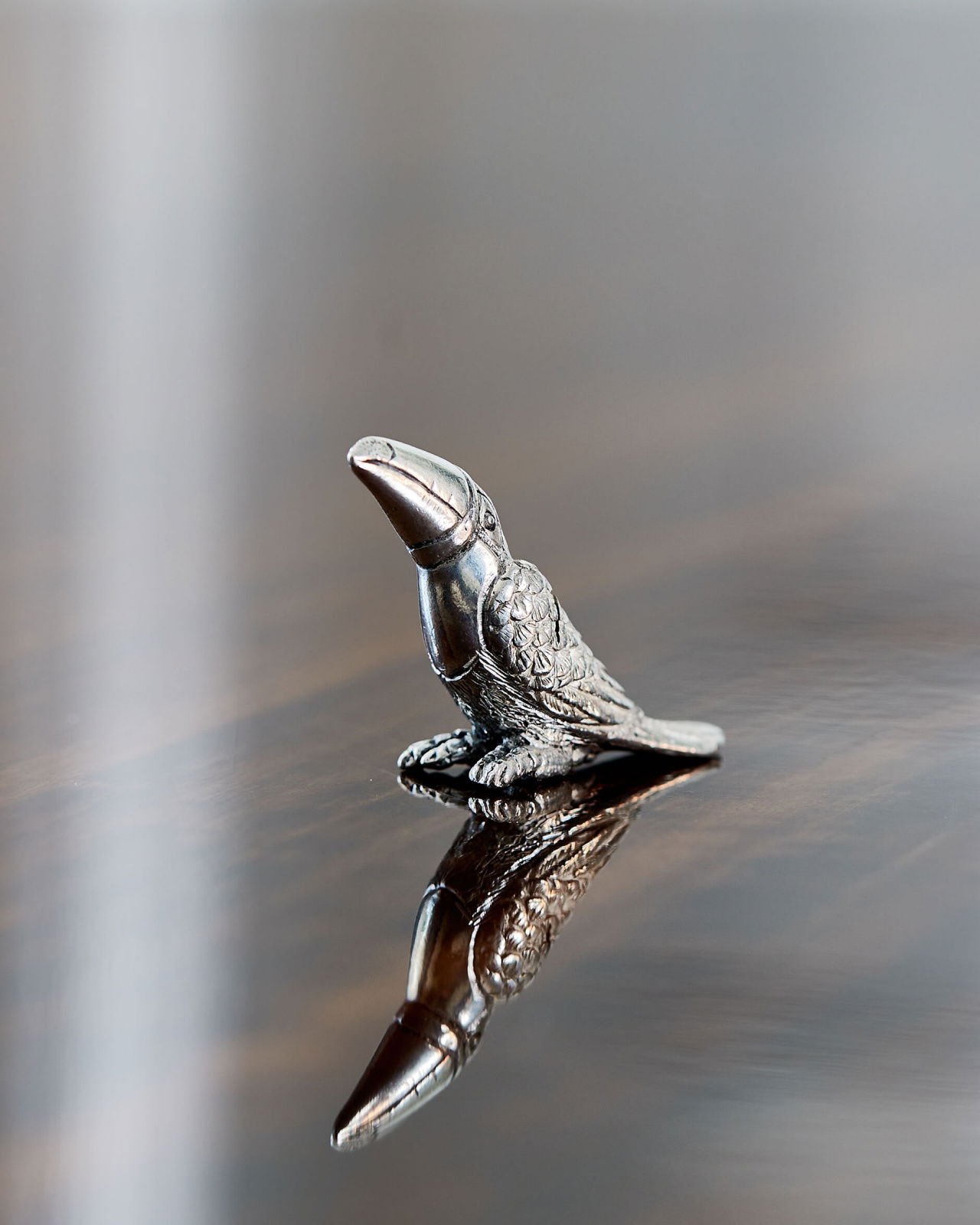 Tukan placeringskortshållare tenn