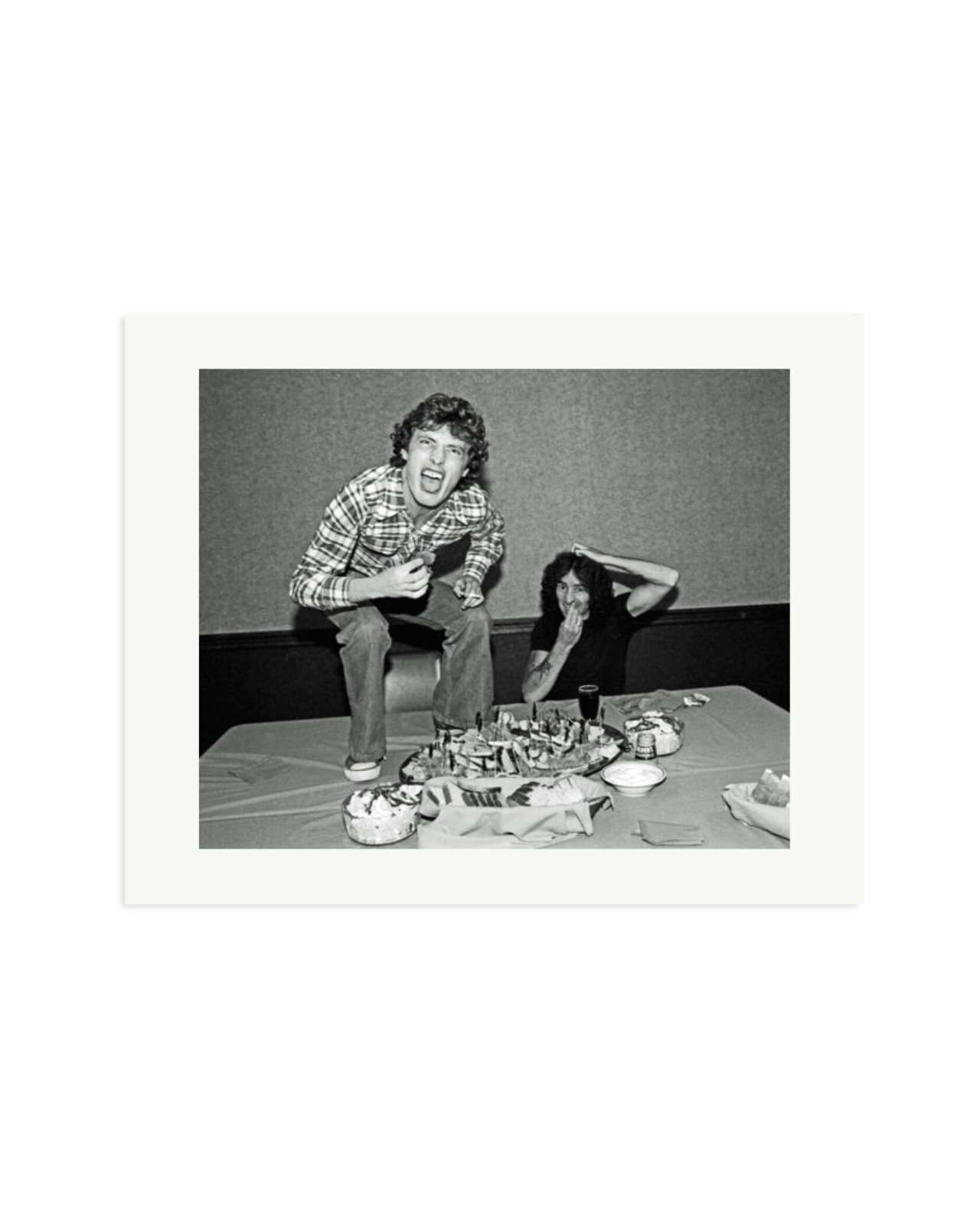 Angus Young and Bon Scott at Lunch, 1977 Print Only / Medium